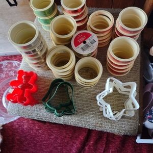 HALLMARK (44) ROLLS OF CHRISTMAS RIBBON AND (10) CHRISTMAS COOKIES CUTTERS.